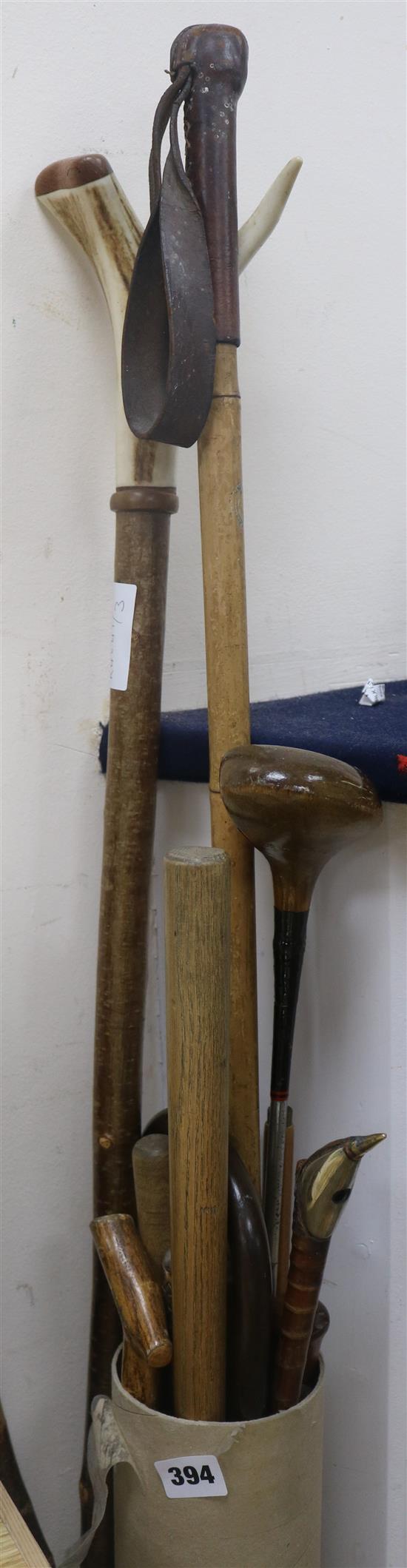 A quantity of walking sticks and two swagger sticks